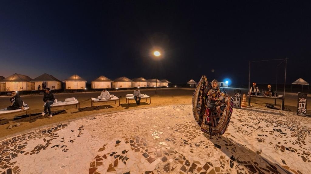 Moonlit tents and lounge seating at desert camp