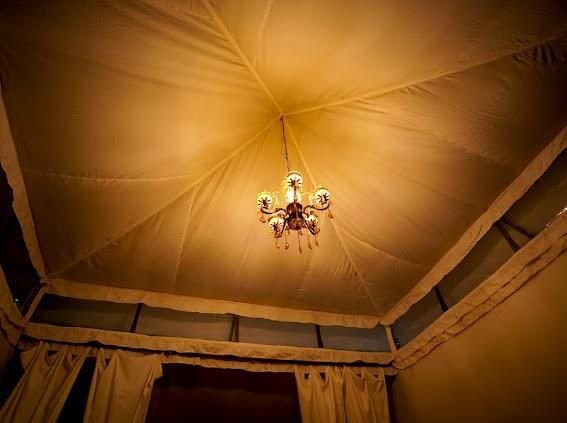 Tent ceiling with hanging chandelier lighting